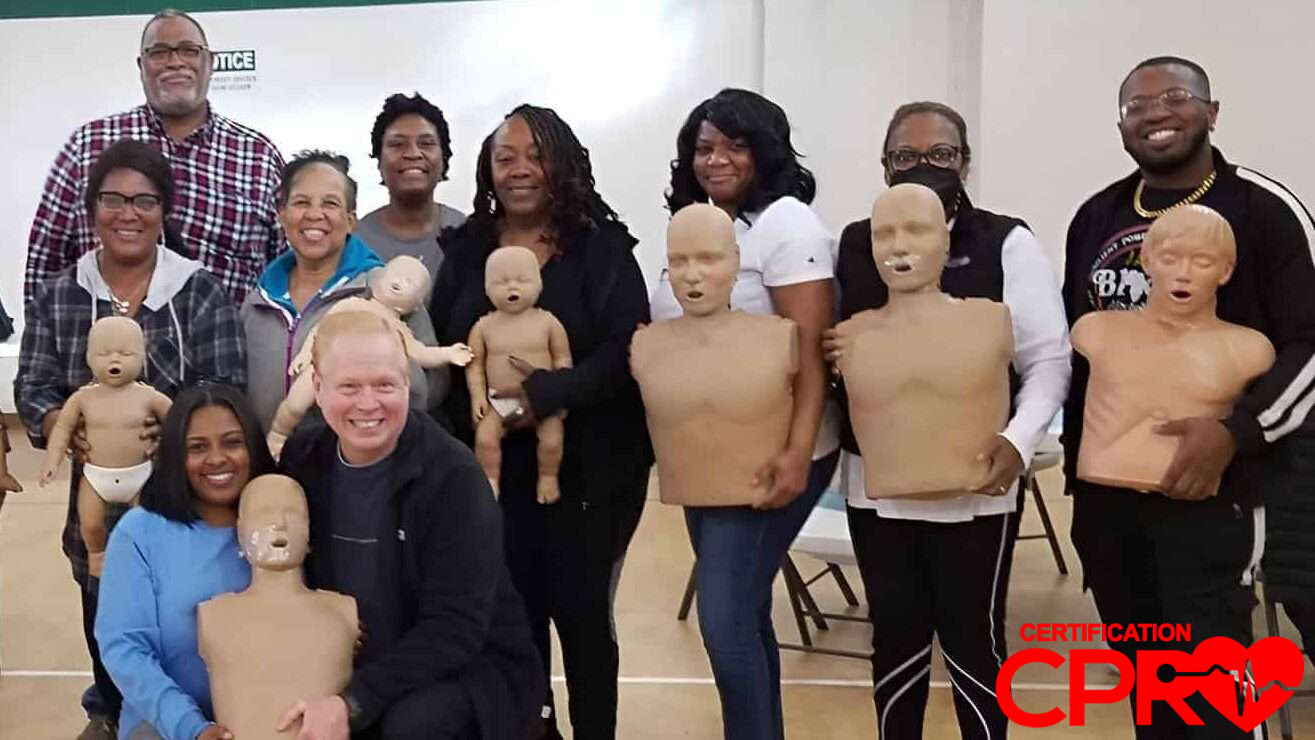 Group CPR training session in Arlington with mannequins for certification.