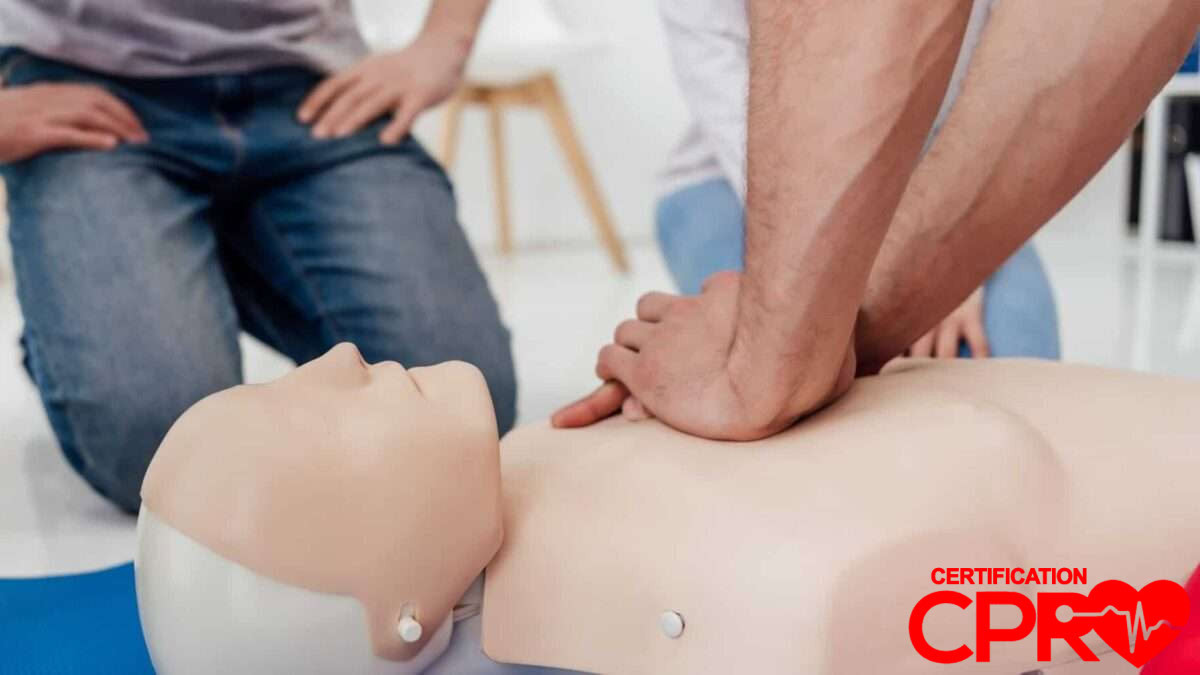 CPR training session with a man practicing on a mannequin in Arlington.